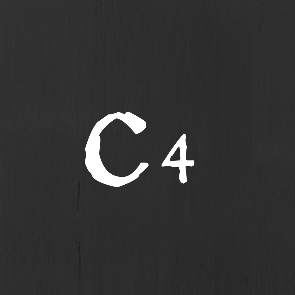 A white  capital C and a small 4 on a textured black background